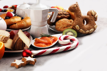 Breakfast served with coffee, orange juice, croissants, cereals and fruits. Balanced diet. Continental breakfast on christmas