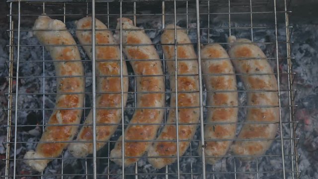 Grill grille and barbecue and mangala mesh. Preparation of sausage on a fire