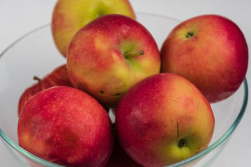 Apples in a glass bowl. 