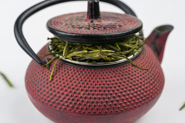 Loose leaf green tea in cast iron kettle. 