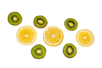 Kiwi and lemon circles on a white background