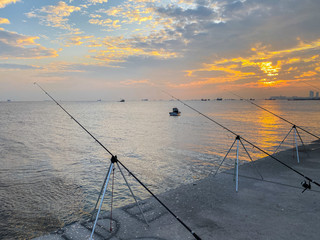 Fishermen fishing at sunset on the shores of the Sea of Marmara in Istanbul Turkey