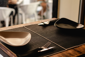 table prepared for customers in restaurant