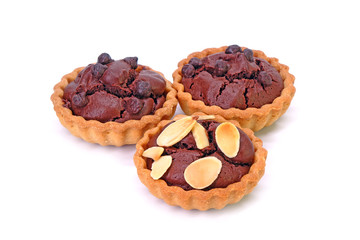 Chocolate tarts topping with sliced almonds and chocolate chips, Isolated on white background.