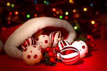 Santa Hat with Red and White ornaments on bokeh background
