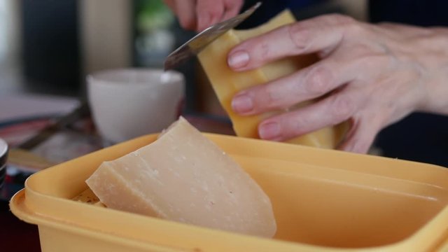  Slicing cheese with cheese slicer
