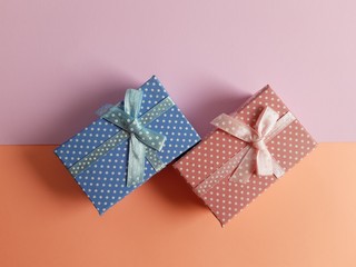 minimal gift boxes with ribbon and bow isolated on pastel background