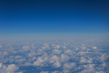 Fototapeta na wymiar White clouds in blue sky view from airplan