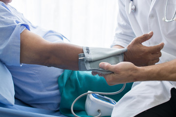 doctor pulse measurement on hand of patient