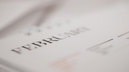 Blurred  month on calendar page.