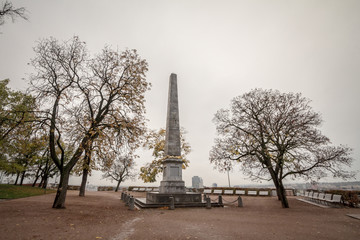 Obelisk of Denisove Sady Gardens, seen during a cold and cloudy rainy afternoon in autumn, in Brno, Czech Republic. This obelisk, in Denis Gardens, was erected in memory to Napoleonic Wars