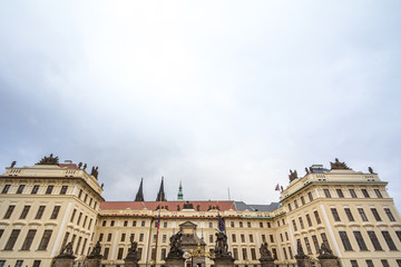 Nove Kralovsky Palac or New Royal Palace in Prague Castle (Prazsky Hrad), seen from its main gate, with its statues of the Wrestling giants, also called sousosi souboj titanu, a landmark of  Prague