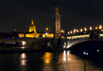 Fototapeta na wymiar Night view of Seine river and Invalides in Paris 
