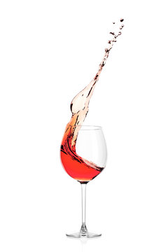 Splash Of Pink Wine In A Glass, Isolated On A White Background