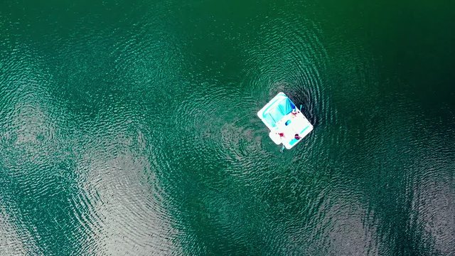 flying down to the rubber boat on the lake