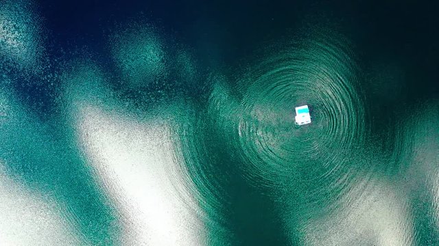 rubber boat on a lake making water rings