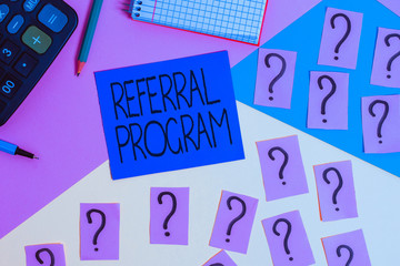 Conceptual hand writing showing Referral Program. Concept meaning employees are rewarded for introducing suitable recruits Mathematics stuff and writing equipment on pastel background