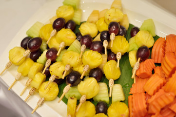 Tropical fruit with stick include pineapple, melon and grape