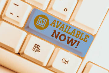 Text sign showing Available Now. Business photo text you can find it obtain or operable at this current moment White pc keyboard with empty note paper above white background key copy space