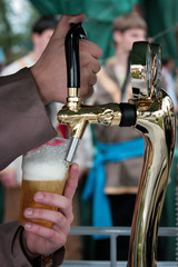 Bartender pouring a glass of fresh beer