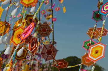 The surface of the fabric is colorful. Hanging on the bamboo in the temple