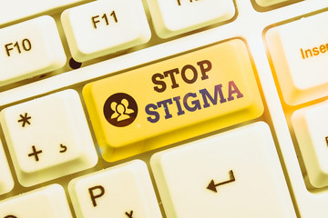 Conceptual hand writing showing Stop Stigma. Concept meaning end the feeling of disapproval that...