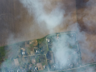 Burning straw in the fields after harvesting wheat crop