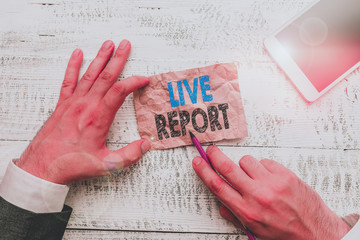 Conceptual hand writing showing Live Report. Concept meaning continuous stream of updates that are...