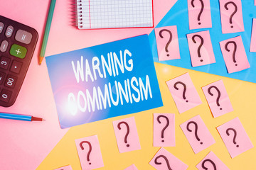 Word writing text Warning Communism. Business photo showcasing economic system where the group owns the production Mathematics stuff and writing equipment above pastel colours background