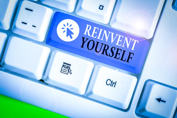 Writing note showing Reinvent Yourself. Business concept for to do something differently from...