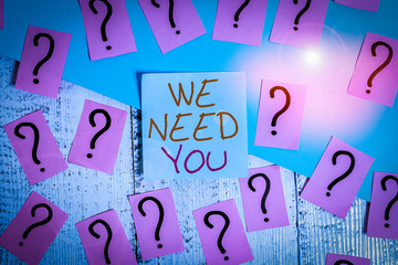 Word writing text We Need You. Business photo showcasing Company wants to hire Vacancy Looking for talents Job employment Scribbled and crumbling papers with thick cardboard above wooden table