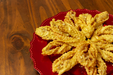 sweet chat with honey syrup in a red dish