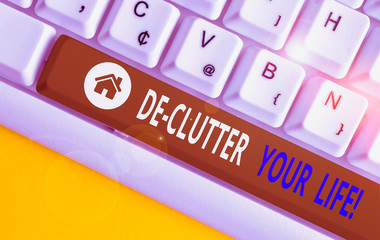 Writing note showing De Clutter Your Life. Business concept for remove unnecessary items from...