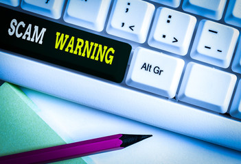 Conceptual hand writing showing Scam Warning. Concept meaning caution of unsolicited email claims...