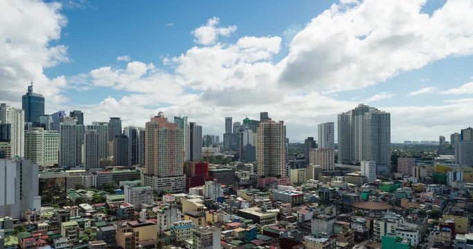 Makati city of Manila time lapse at noon with fast moving clouds