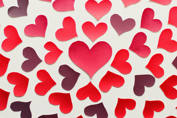 Valentine's day greeting card with a pattern of fabric red hearts.