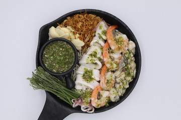 Thai spicy seafood salad with shrimp, squid and oyster with seafood sauce