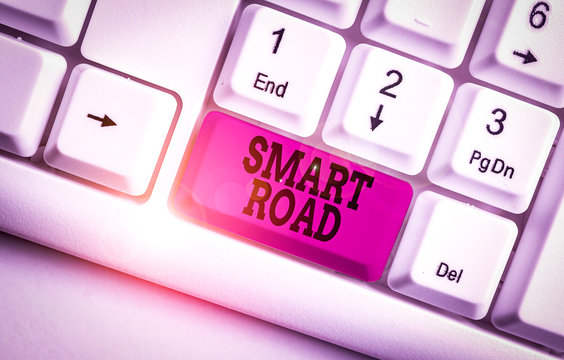 Word writing text Smart Road. Business photo showcasing number of different ways technologies are incorporated into roads White pc keyboard with empty note paper above white background key copy space