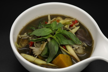 Thai herb soup with mushrooms and pumpkin