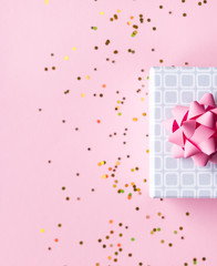 Gift box on pink background.