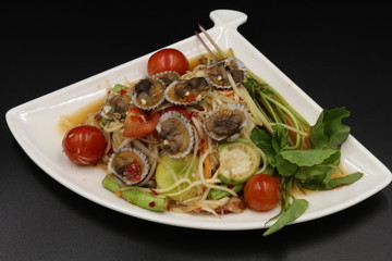 Somtum (Thai spicy salad) with scallop and vegetable in white plate