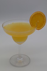 Maitai cocktail in martini glass with orange on top