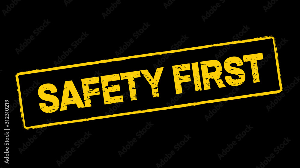 Wall mural safety first stamp on black background. vector illustration