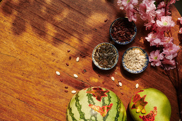 Lunar New Year background with fresh fruits and various seeds