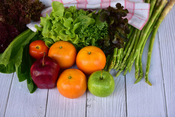 Top view Variety of fruits and vegetables, on the white wooden table background. Concept Healthy food. Copy space. Selective focus