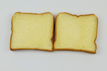 Sliced of yellow bread on white background