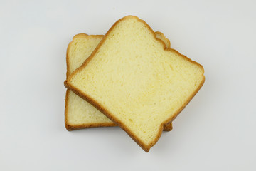Sliced of yellow bread on white background