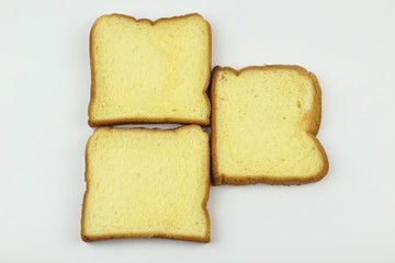 Sliced of yellow bread on white background