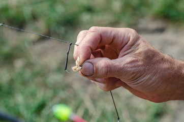 spinner with a triple hook for fishing in the hand. Nature