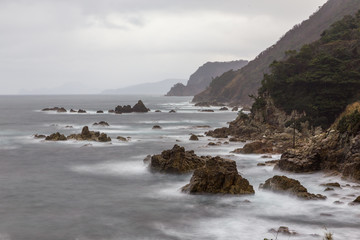Fototapeta na wymiar Cliffs and coastlina on the sea of Japan
